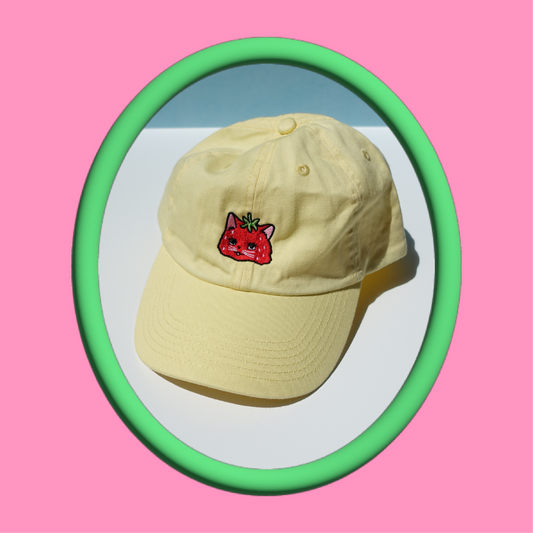 Embroidered dad hat featuring a cute strawberry cat design on yellow fabric
